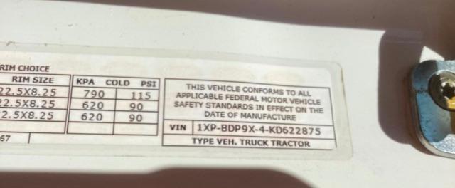Vehicle data plate showing tire sizes and pressure: rim size 22.5x8.25, KPA 790/620, cold psi 115/90; 623? This vehicle conforms to safety standards; VIN 1XPBDP9X4KD622875; Type: TRUCK TRACTOR.