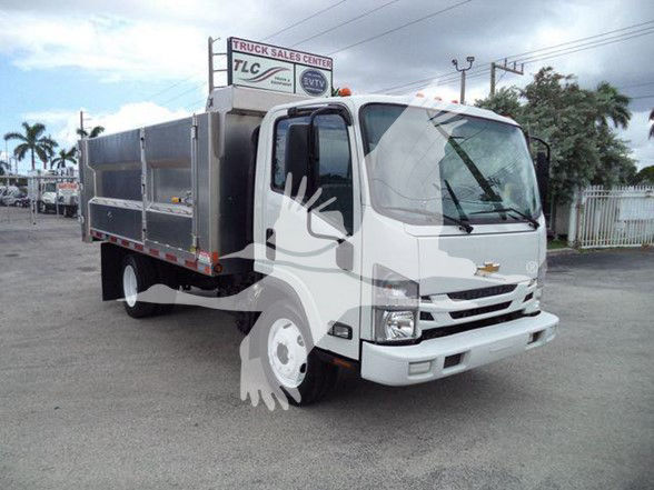 Front three-quarter view of a white 2017 Chevrolet W4500 dump truck with gray dump body, side mirrors, and black grille. VIN and stock number not visible on vehicle.