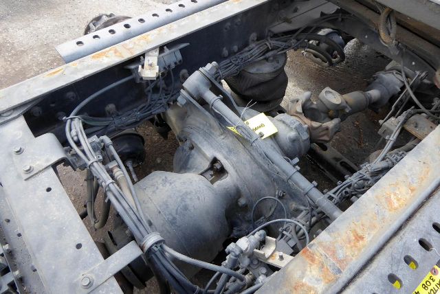 Meritor MT4014X truck component in engine bay showing differential and drive components with wiring and label stickers.