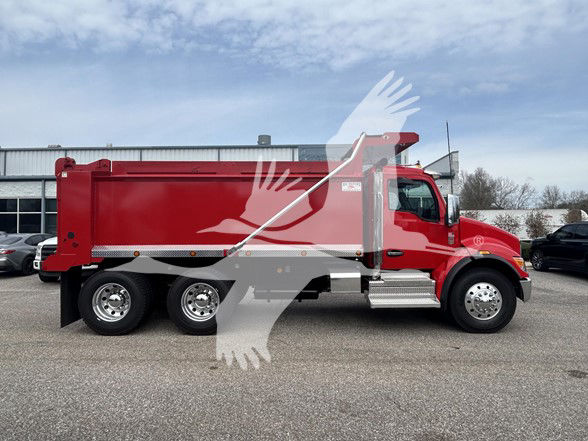 Kenworth T480 dump truck side view showing red dump body and chrome steps.
