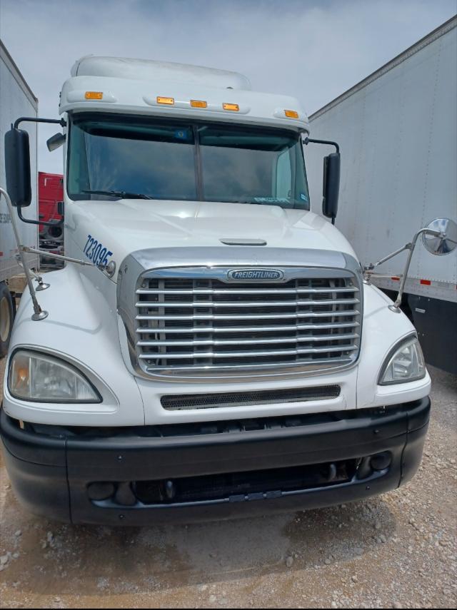 Freightliner Columbia truck front view showing chrome grille, white cab, large bumper, and headlights.