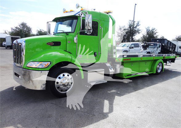 Green 2022 Peterbilt 337 tow truck with chrome front bumper and extended flatbed, stock number J47210.