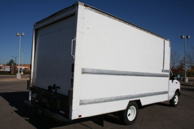 White box-style moving van with cargo area, rear doors closed, and a standard cab. No visible branding on the sides.