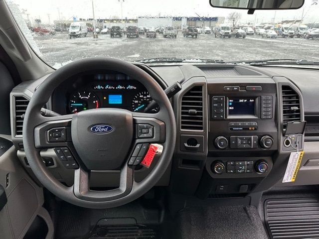 Ford F-550 interior dashboard and steering wheel with center console and digital display.