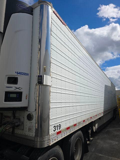 2016 Great Dane SS reefer trailer side and rear showing Carrier Thermo King trailer unit on front left with white panels and black 319 numbering on lower side
