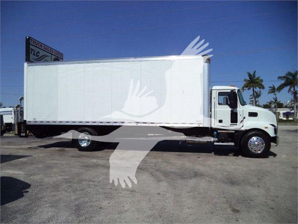 Box truck side view showing a white 2023 Mack MD6 with a large cargo box.
