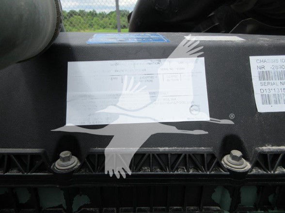 Front sleeper area of a 2022 Volvo VNL64T740 with VIN plate and stock label visible; partial sticker text shows serials and barcodes.
