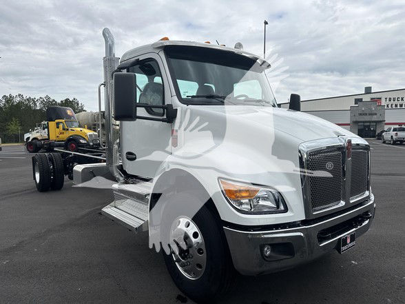 Kenworth T380 cab-forward truck in white, front three-quarter view, with large chrome grille, vertical exhaust stacks, side steps, and dual rear axles.