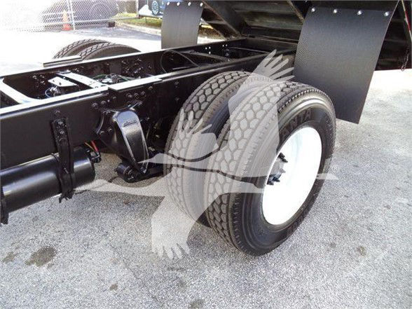 Freightliner Business Class M2 106 chassis rear with dual rear wheels and suspension components visible.