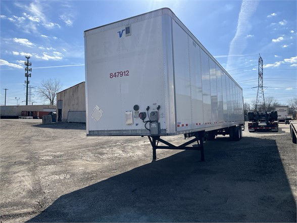 2018 Vanguard dry van trailer with front landing gear and rear doors visible, stock number 847912 on nose.