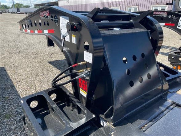 Fontaine 55 ton steel lowboy trailer with flat low deck, black paint, exposed hydraulic components and perforated side panels.