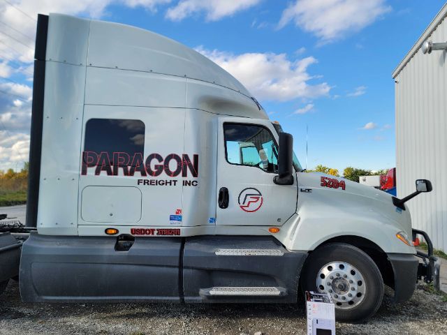 2019 International LT625 semi-truck tractor in side view showing Paragon Freight Inc graphics on sleeper cab and S204 badge on hood.