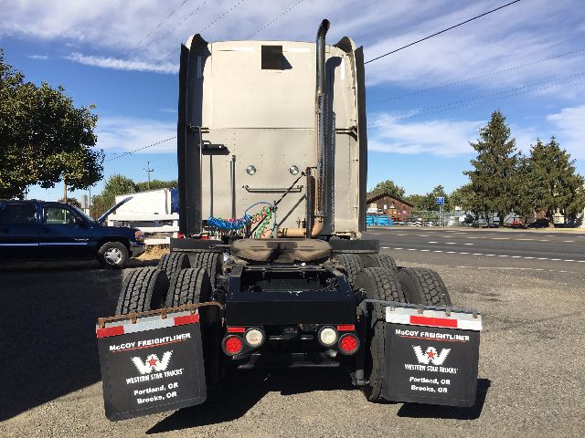Peterbilt 578 rear view showing dual rear wheels and mud flaps with Western Star Trucks branding.