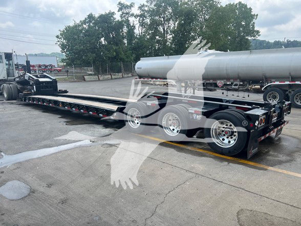 XL Specialized XL110Hdgs18 Guardian 55-Ton trailer on a lowboy with dual rear axles and a long flat deck.