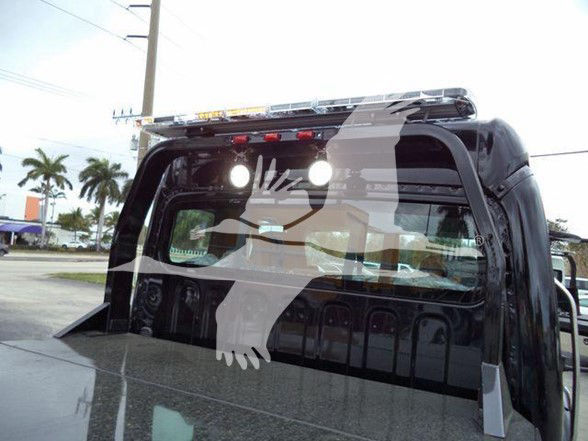 Truck bed with cab back and cab interior visible, Freightliner branding not shown.