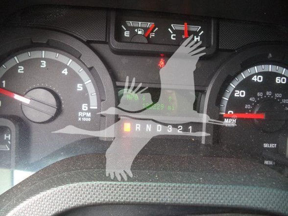 Dashboard of a Ford E-450 showing gear selector PRND321 and gauges including RPM and speedometer.