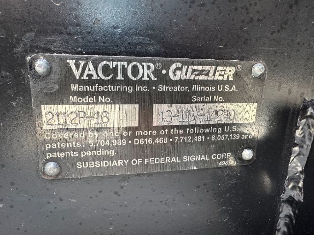 Identification plate on Vactor Guzzler equipment showing model and serial numbers.