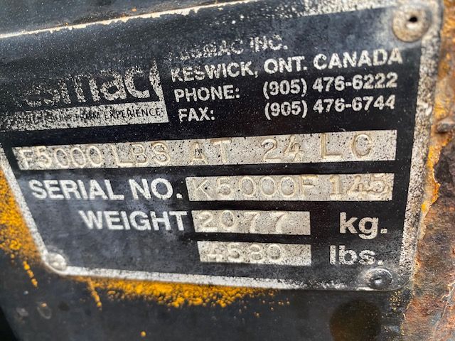 Industrial lifting equipment label showing model Kesmac F5000 with serial number K5000F 125, weight 2697 kg, 5000 lbs? visible text includes 'KESWICK ONT CANADA' contact numbers, 'SERIAL NO. K5000-125', 'WEIGHT 2697 kg' and other labels.