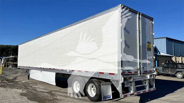 Trailer rear and side view of a 2023 Vanguard Cool Globe reefer trailer with white exterior.