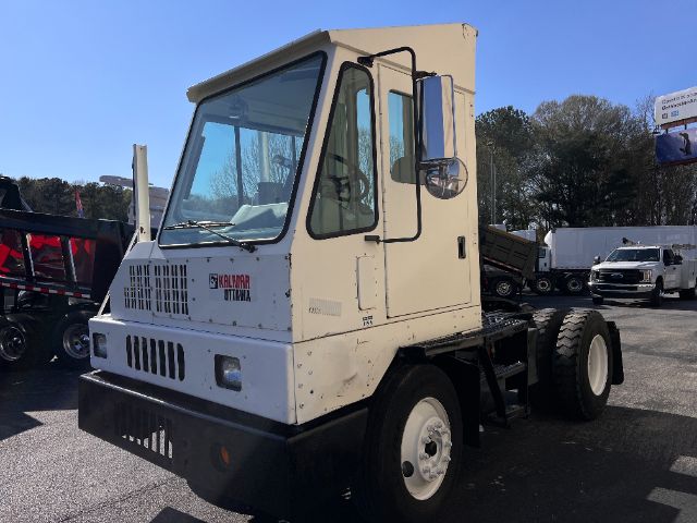 Kalmar Ottawa 30 yard truck cab with large front grille, white paint, and dual rear wheels. Visible text on cab: 'KALMAR OTTAWA' logo on front.