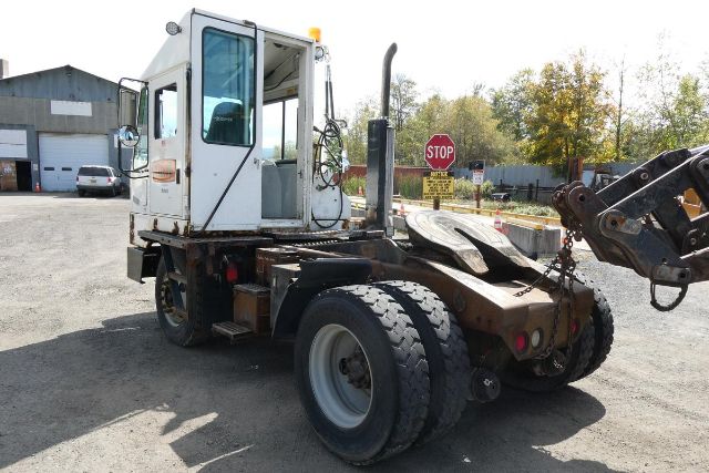 Ottawa YT30 yard truck with white cab, view of rear chassis and hook attachment.