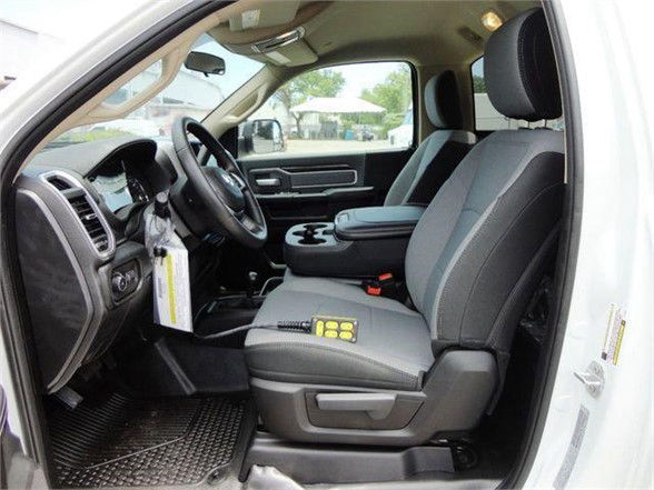 2024 Ram 4500 SLT interior front seats, steering wheel, dashboard, and center console visible.
