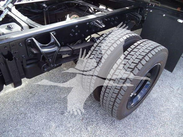 Chevrolet Silverado 6500HD truck chassis showing dual rear wheels and suspension components.