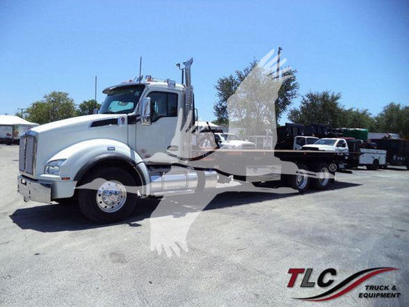 Kenworth T880 heavy-duty tow truck tractor in white with long wheelbase and flatbed trailer, side view, stock number J11612FM, TLC Truck & Equipment watermark.