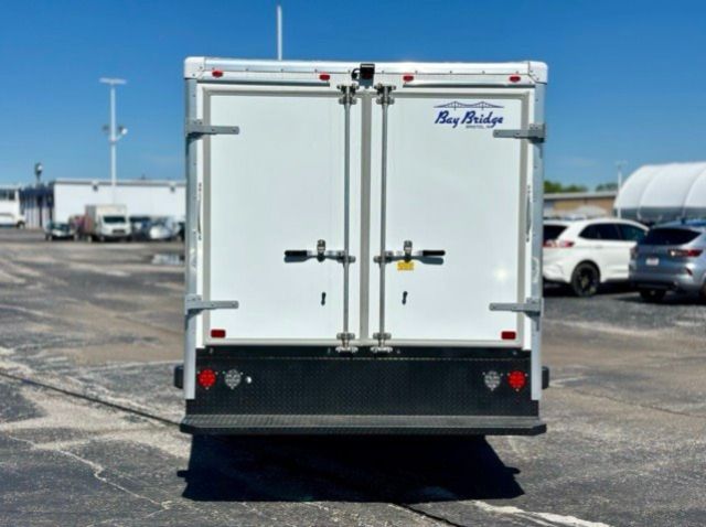 Ford Transit 350 box truck rear doors with Bay Bridge logo sticker and metal latches.