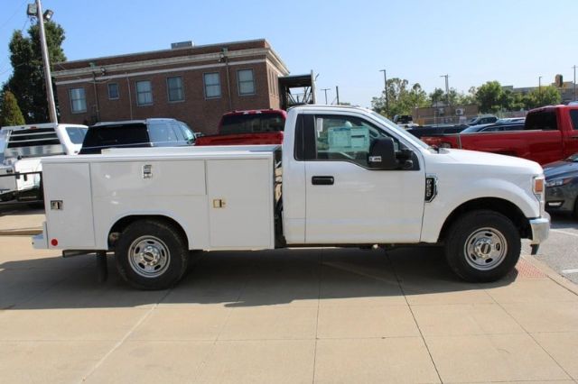 Ford F-250 service body truck side view showing work utility van body with compartments.