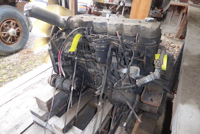 Truck engine right side view showing 1992 Cummins EFISB 5.9L engine with wiring harnesses and hoses.