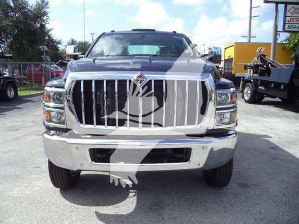 Front view of a 2023 International CV truck showing large chrome grille and bumper.