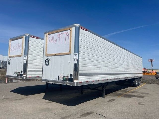 Great Dane 53' x 102" disc brake trailer in reefer category, white exterior, dual tandem axles, parked outdoors under a clear blue sky.