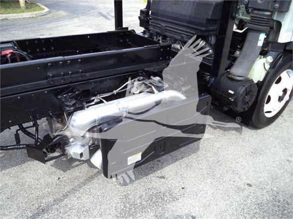 Isuzu NRR chassis with fuel/air system and exhaust components visible; no visible text legible on components.