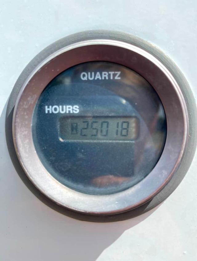 Quartz hour meter reading 250.18 hours on a gauge