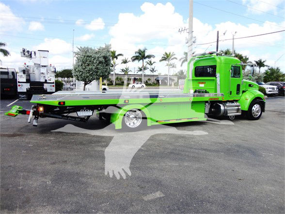 Tow truck flatbed with bright green cab and long flatbed, Peterbilt 337 style, stock number J47210