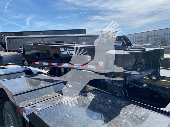 Load King spreader bar mounted on a trailer with black finish and white Load King logo.