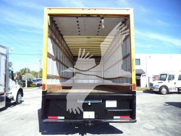 Box truck rear Cargo area open showing empty interior and black bulkhead with taillights.