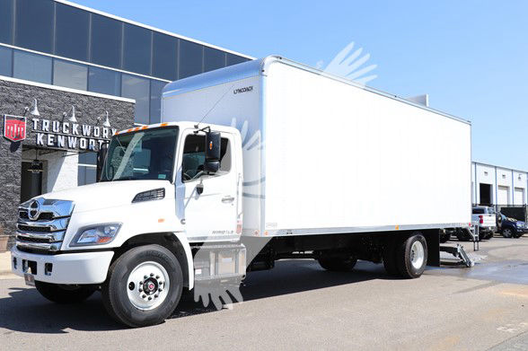 White Hino L6 cab and box truck in a dealership lot, side view showing the cargo box and cab.