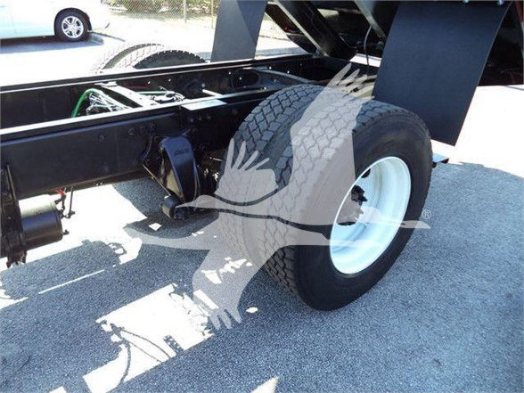 Freightliner Business Class M2 106 chassis photograph showing rear-right wheel, frame, and drivetrain components.