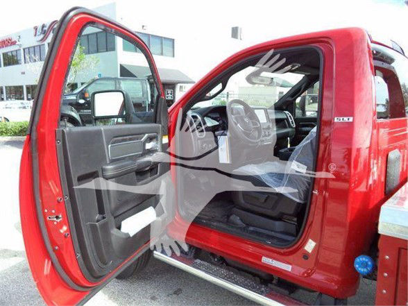 Ram 4500 SLT truck open driver door interior view showing crew cab and red exterior.
