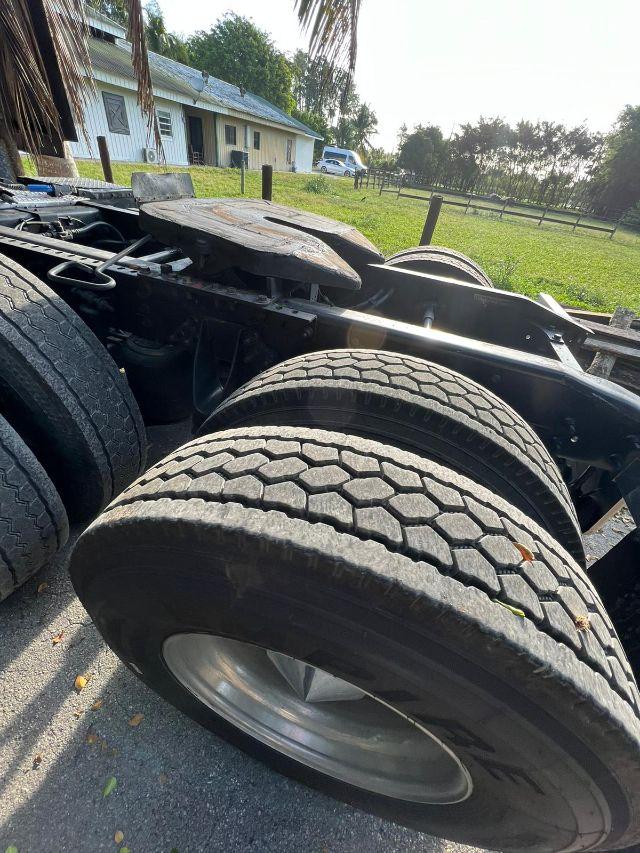 International Prostar heavy-truck rear dual rear axles with dual tires and fifth wheel area visible.