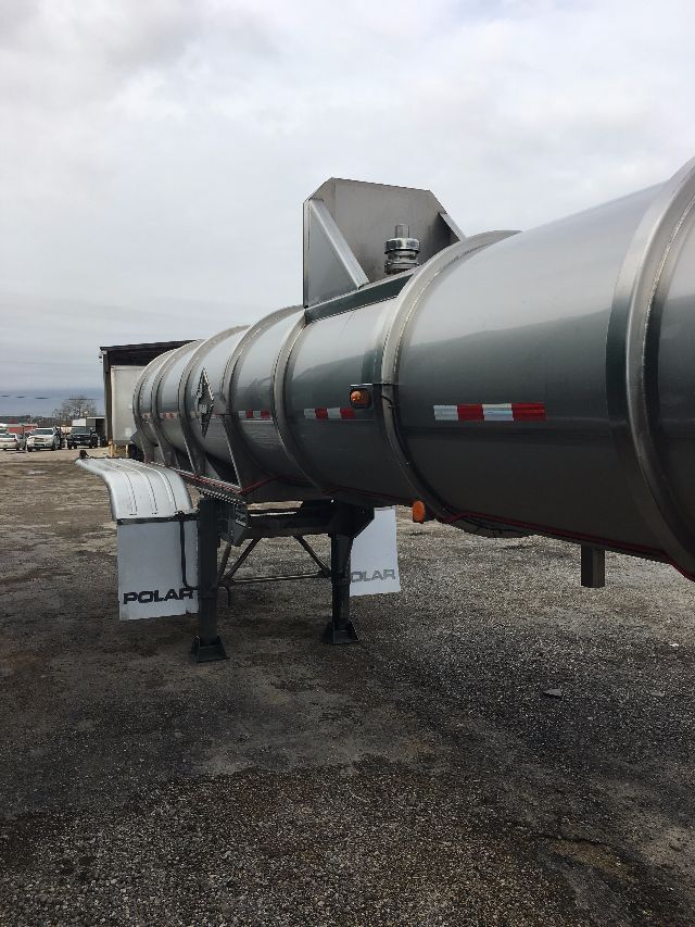 Polar SRX2 tank trailer showing cylindrical aluminum tank with support legs and Polar branding on mud flaps.