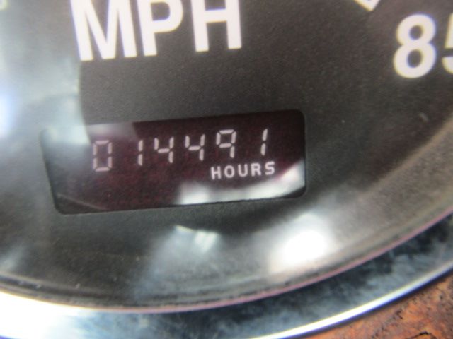 Mack CV513 dashboard odometer showing 01449.1 hours.