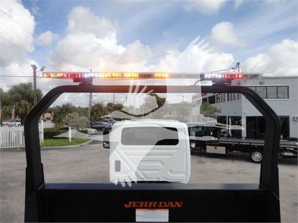 Truck bed with Jerridan branding and rear view showing LED light bar on top crossbar.