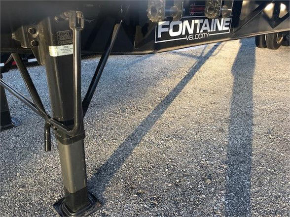 Fontaine Velocity trailer landing gear and underside with support leg visible and Fontaine Velocity branding on bumper.