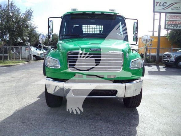 Front view of a green 2015 Freightliner BUSINESS CLASS M2 106 tow truck showing grille, headlights, bumper, and windshield.