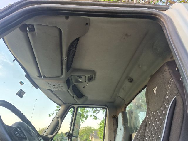 Interior overhead view of 2008 International 8600 cab showing sun visor, overhead panel, and ceiling upholstery.