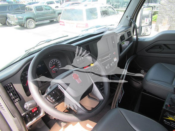 Kenworth T480 interior view showing steering wheel dashboard and center console.