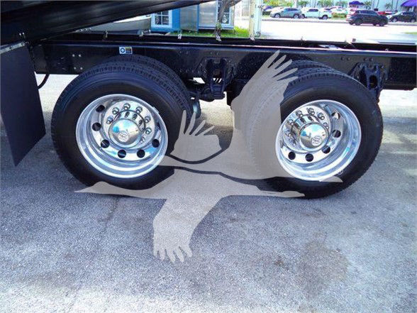 Kenworth T880 undercarriage showing dual rear wheels and chassis frame.